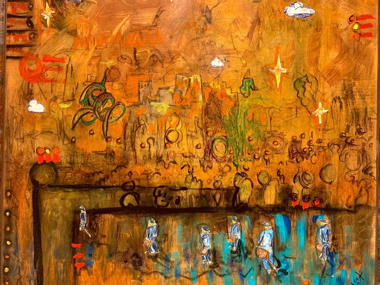 A wall painted in burnt orange and covered in small hand painted figures and marks